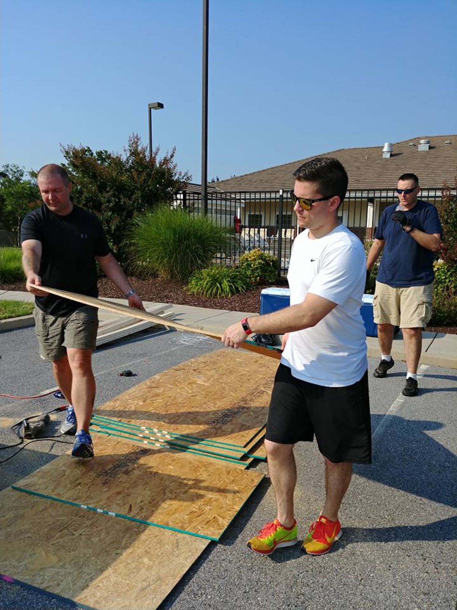 TSgt. Jerry Ivey, 436th AW Command Post, Leeann Ivey, spouse of TSgt. Ivey, SSgt. Kyle Kubon, 436th AW CP, and SMSgt. Jeffrey Hamilton,436th AW CP, build Airmen’s Attic donation boxes July 20, 2017, on Dover AFB, Del. The boxes will be used to help the Airmen’s Attic get donations and make dropping off more convenient for base residents. “We built them to help the airmen's attic get donations. The problem was that with their hours, people had a hard time getting donations to them,” said Ivey. “There were donation boxes in housing, but they were for good will. I thought if we could give to people off base we should be able to take care of our own.”
