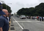 Members of the Commander Fleet Activities Yokosuka community come together to participate in a “Line of Honor,” honoring the crew and families of the USS Fitzgerald.  