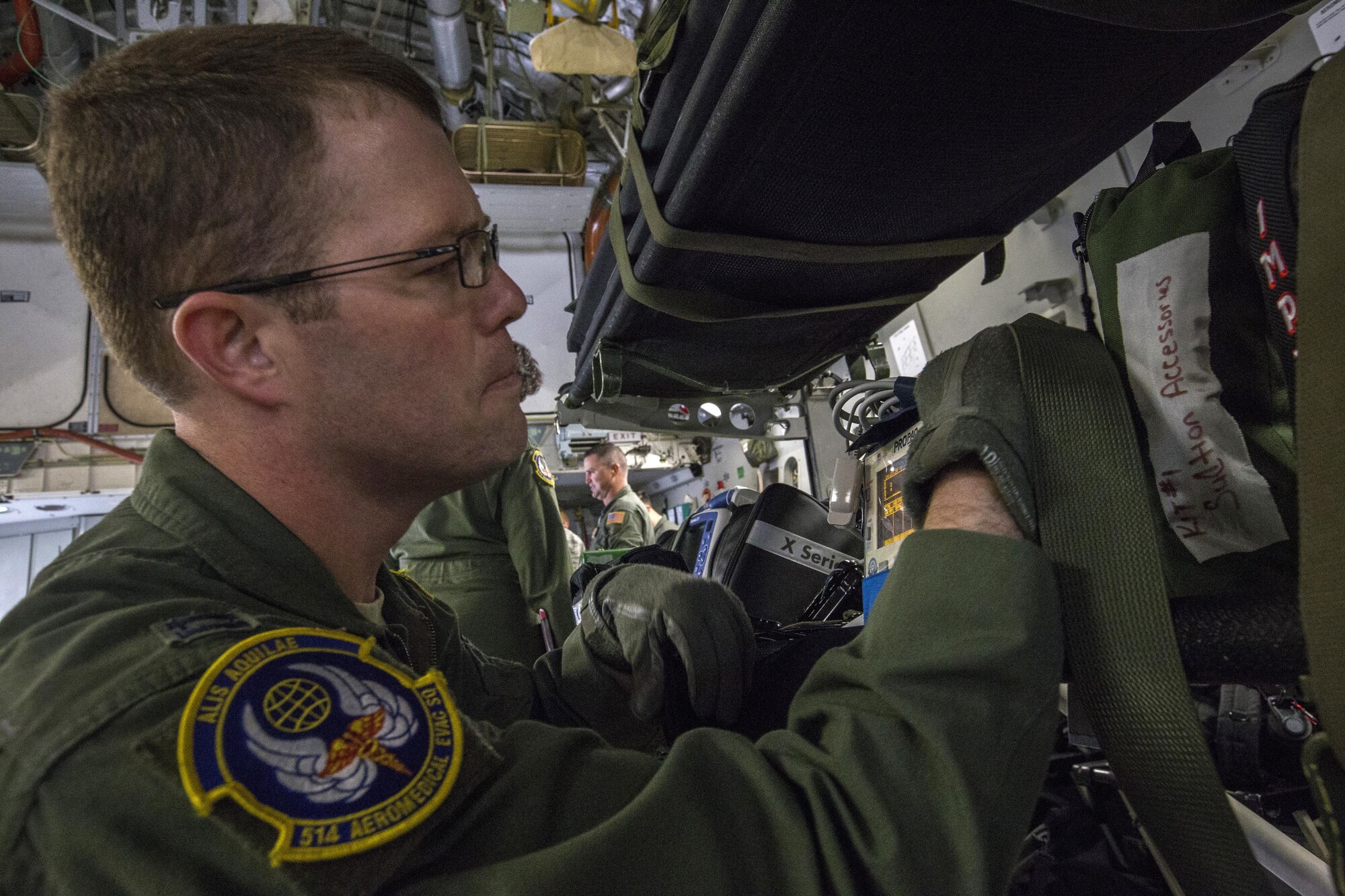 U.S. Air Force Capt. Robert E. Holland, flight nurse, 514th Aeromedical Evacuation Squadron, 514th Air Mobility Wing, performs an equipment check during an aeromedical evacuation training mission onboard a 305th Air Mobility Wing C-17 Globemaster III to Nashville, Tenn., July 29, 2017. The training’s purpose is to teach flight nurses and aeromedical evacuation technicians how to respond to scenarios during the evacuation of sick or wounded personnel, and how to handle medical situations that might occur during the flight. The 514th Aeromedical Evacuation Squadron is located at Joint Base McGuire-Dix-Lakehurst, N.J. (U.S. Air Force photo by Master Sgt. Mark C. Olsen/Released)