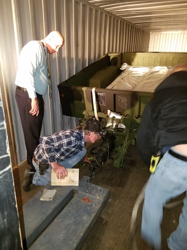 A DLA Distribution Tobyhanna Team work to find a safe manner to secure and ship four cargo trailers in the most effective, efficient and best value method possible.