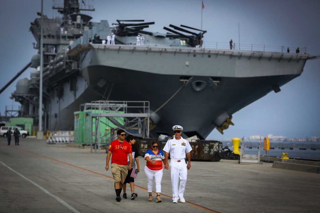 A sailor stationed aboard the USS America LHD-6 spends time with his family before boarding the ship at Naval Base San Diego prior to departing on the America Amphibious Ready Group/15th Marine Expeditionary Unit’s Western Pacific 17-2 deployment July 7, 2017. The 15th MEU will provide a forward-deployed, flexible sea-based Marine Air-Ground Task Force capable of conducting a variety of combat and humanitarian missions. (U.S. Marine Corps photo by Sgt. Will Perkins)