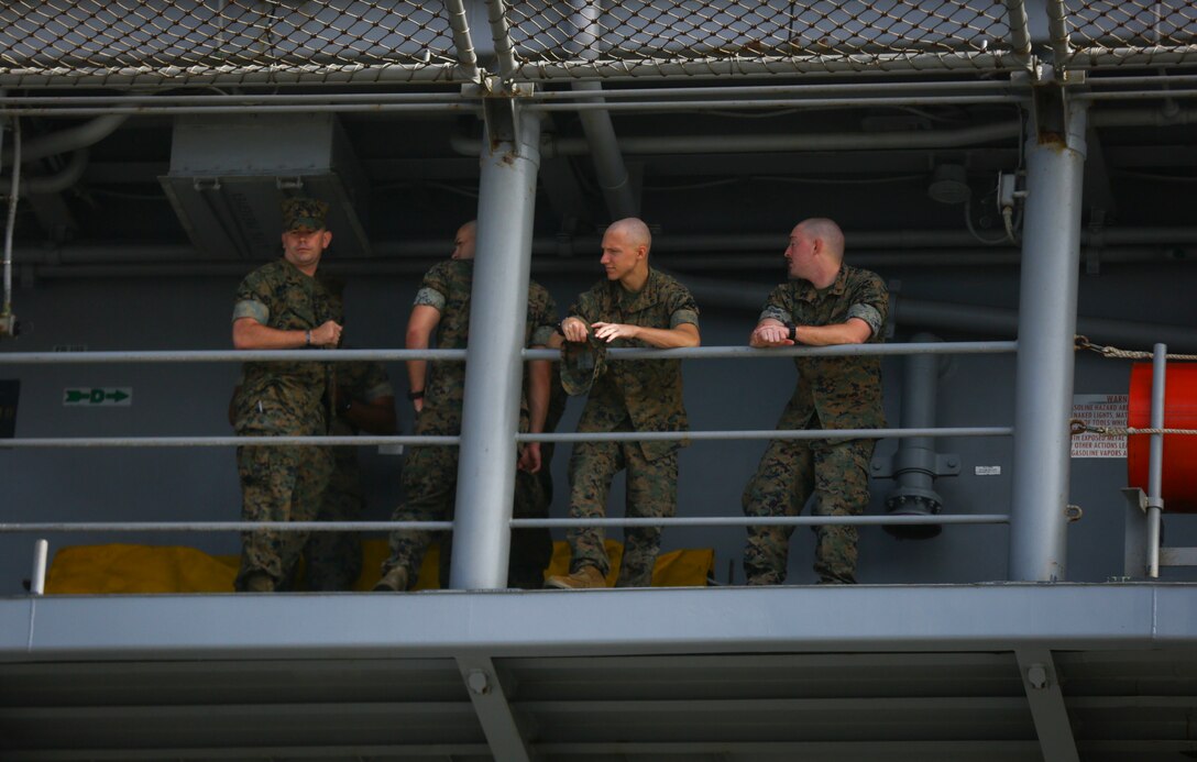 Marines with the 15th Marine Expeditionary Unit wait for the USS America LHD-6 to depart Naval Base San Diego July 7, 2017. During the deployment America Amphibious Ready Group/15th Marine Expeditionary Unit’s Western Pacific 17-2 will provide a forward-deployed, flexible sea-based Marine Air-Ground Task Force capable of conducting a variety of combat and humanitarian missions. (U.S. Marine Corps photo by Sgt. Will Perkins)