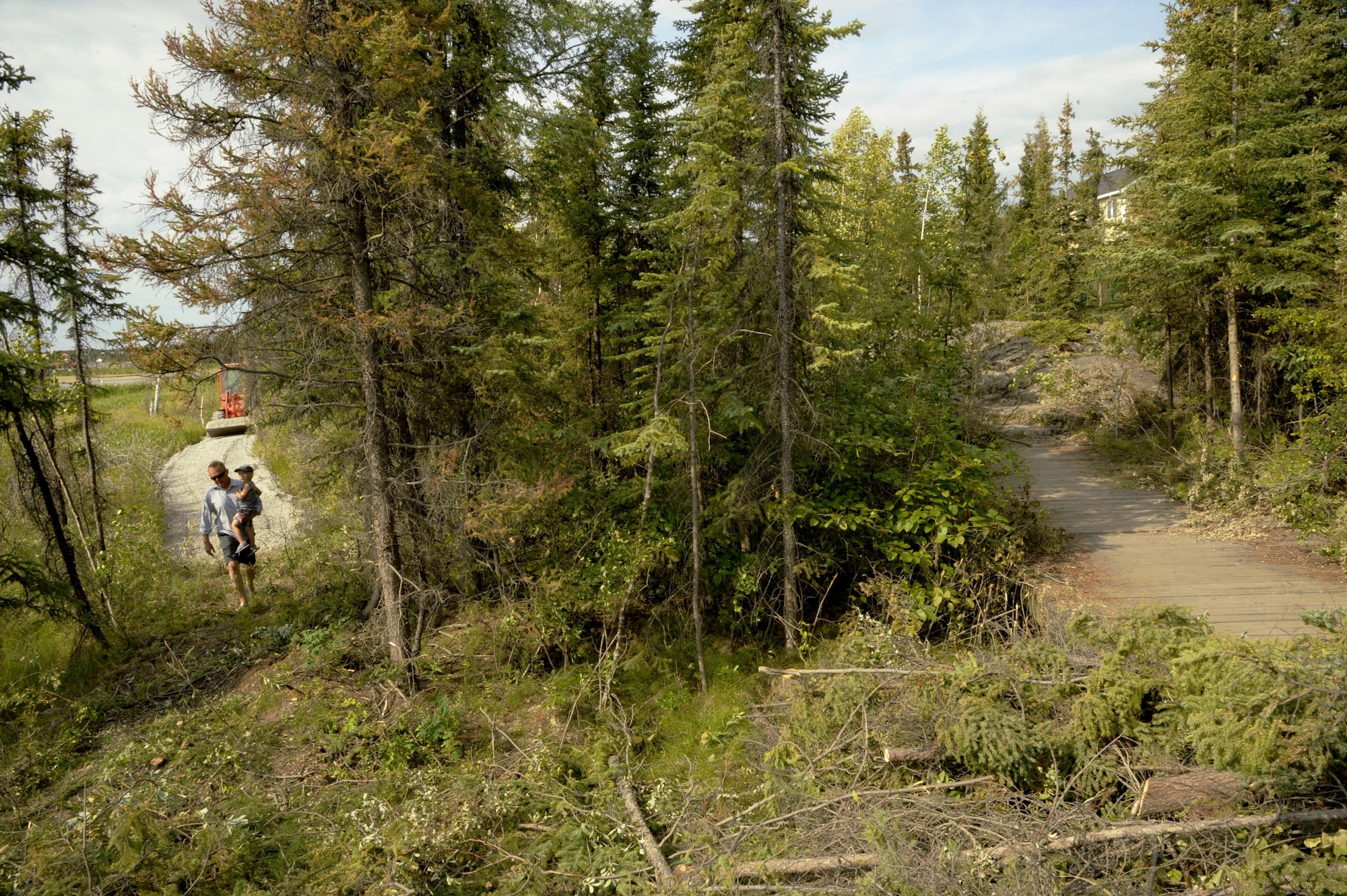 Oregon Air National Guardsmen from the 142nd Fighter Wing Civil Engineer Squadron, Portland, Oregon, work to construct a new pedestrian friendly trail (picture left) at Niven Lake in Yellowknife, Northwest Territories, Canada during their two-week Deployment For Training, July 21, 2017. The Oregon Airmen are also collaborating with Canadian Armed Forces members from Cold Lake, Alberta, who are also deployed to Yellowknife for training. (U.S. Air National Guard photo/Master Sgt. John Hughel, 142nd Fighter Wing Public Affairs)