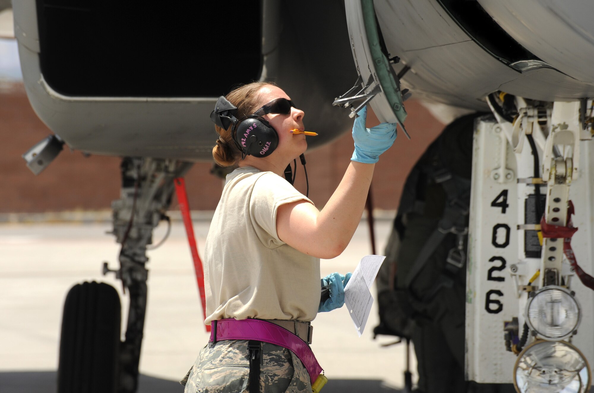 Oregon Air National Guard Senior Airman Aimee Lonidier, a crew chief with the 142nd Fighter Wing does a post flight check of an F-15 Eagle at Nellis Air Force Base, Nev., during the Weapons Instructor Course, May 30, 2017 (U.S. Air National Guard photo by Master Sgt. John Hughel, 142nd Fighter Wing Public Affairs). 