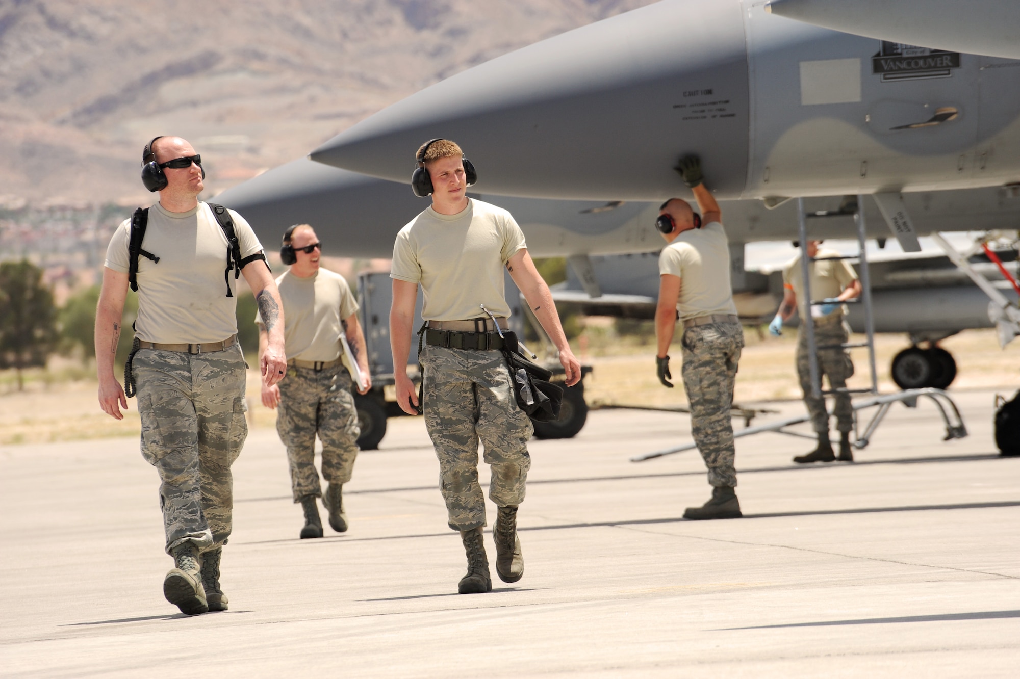 Oregon Air National Guard Airmen assigned to the 142nd Fighter Wing Maintenance Group finish an afternoon launch of F-15 Eagles at the Nellis Air Force Base, Nev., flightline during the Weapons Instructor Course, May 30, 2017 (U.S. Air National Guard photo by Master Sgt. John Hughel, 142nd Fighter Wing Public Affairs).