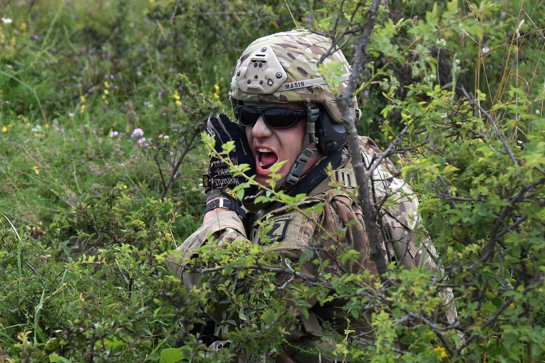 A soldier yells out follow on orders.