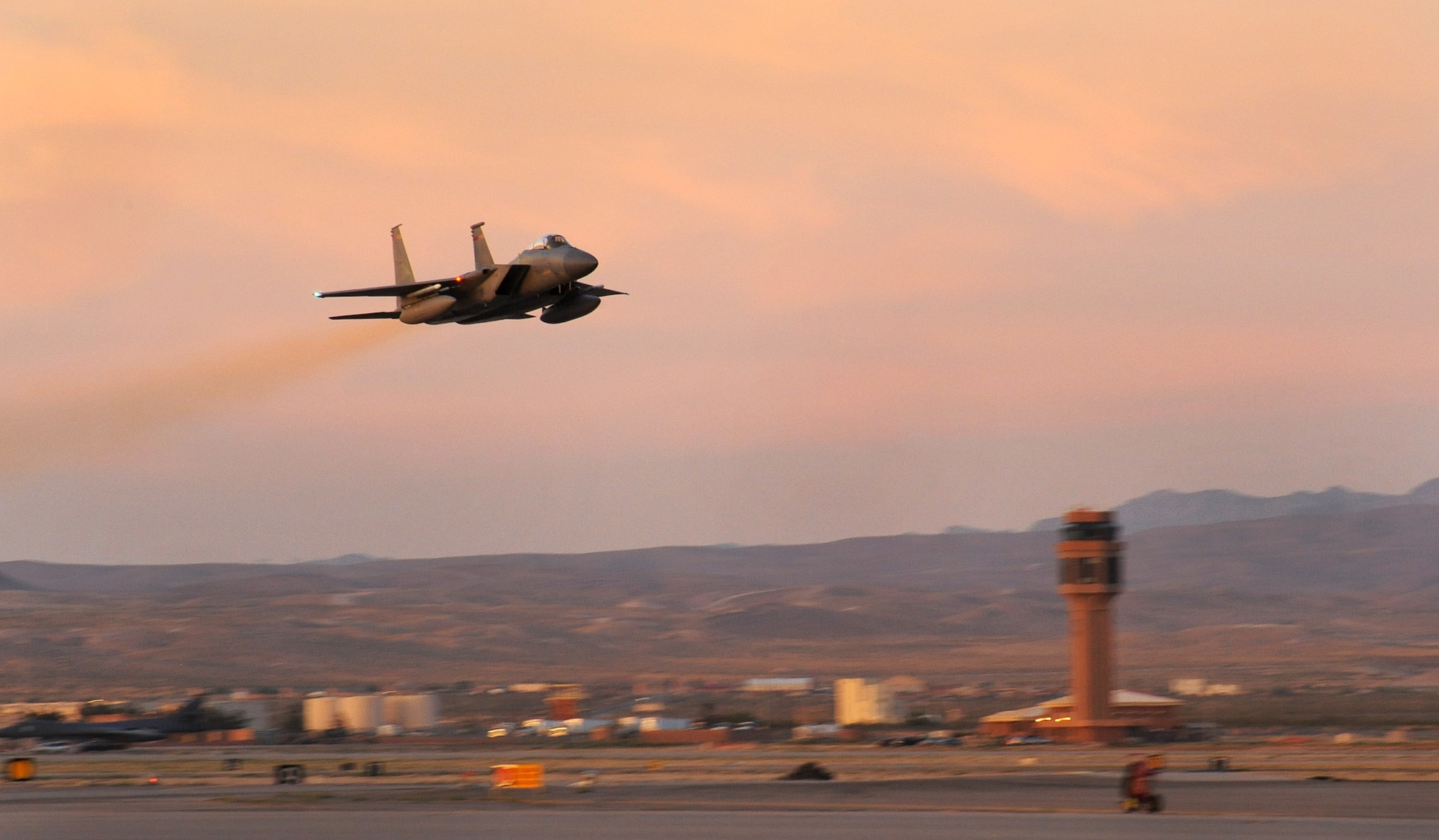 An Oregon Air National Guard F-15 Eagle, assigned to the 142nd Fighter Wing, takes off from Nellis Air Force, Nev., on a late day sortie, June 8, 2017. Over 120 Oregon Air Guardsmen are supporting the Weapons Instructor Course during their three-week duty assignment. (U.S. Air National Guard photo by Master Sgt. John Hughel, 142nd Fighter Wing Public Affairs)