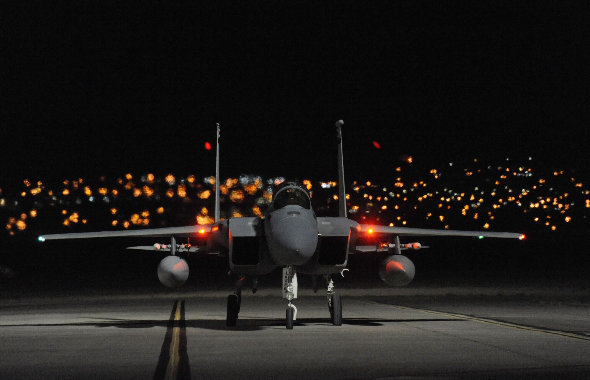 An Oregon Air National Guard F-15 Eagle, assigned to the 142nd Fighter Wing, returns to Nellis Air Force, Nev., after a late day sortie in support of the Weapons Instructor Course, June 8, 2017. Over 120 Oregon Air Guardsmen are supporting the Weapons Instructor Course during their three-week duty assignment. (U.S. Air National Guard photo by Master Sgt. John Hughel, 142nd Fighter Wing Public Affairs)