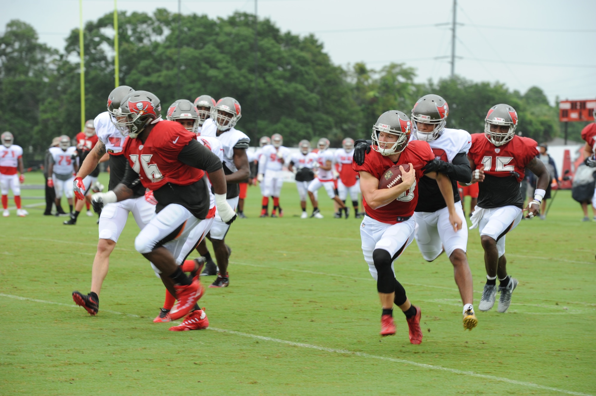 The season’s first pads-on day at the Tampa Bay Buccaneers Training Camp, was no ordinary day at One Buc Place, Tampa, Florida, July 31, 2017. Instead of the bleachers filled with your traditional fans, Airmen from the 927th Air Refueling Wing along with other military members from MacDill Air Force Base, Florida showed up in force to cheer on their hometown team, the Tampa Bay Buccaneers. (U.S. Air Force Photo by TSgt. Peter Dean) 