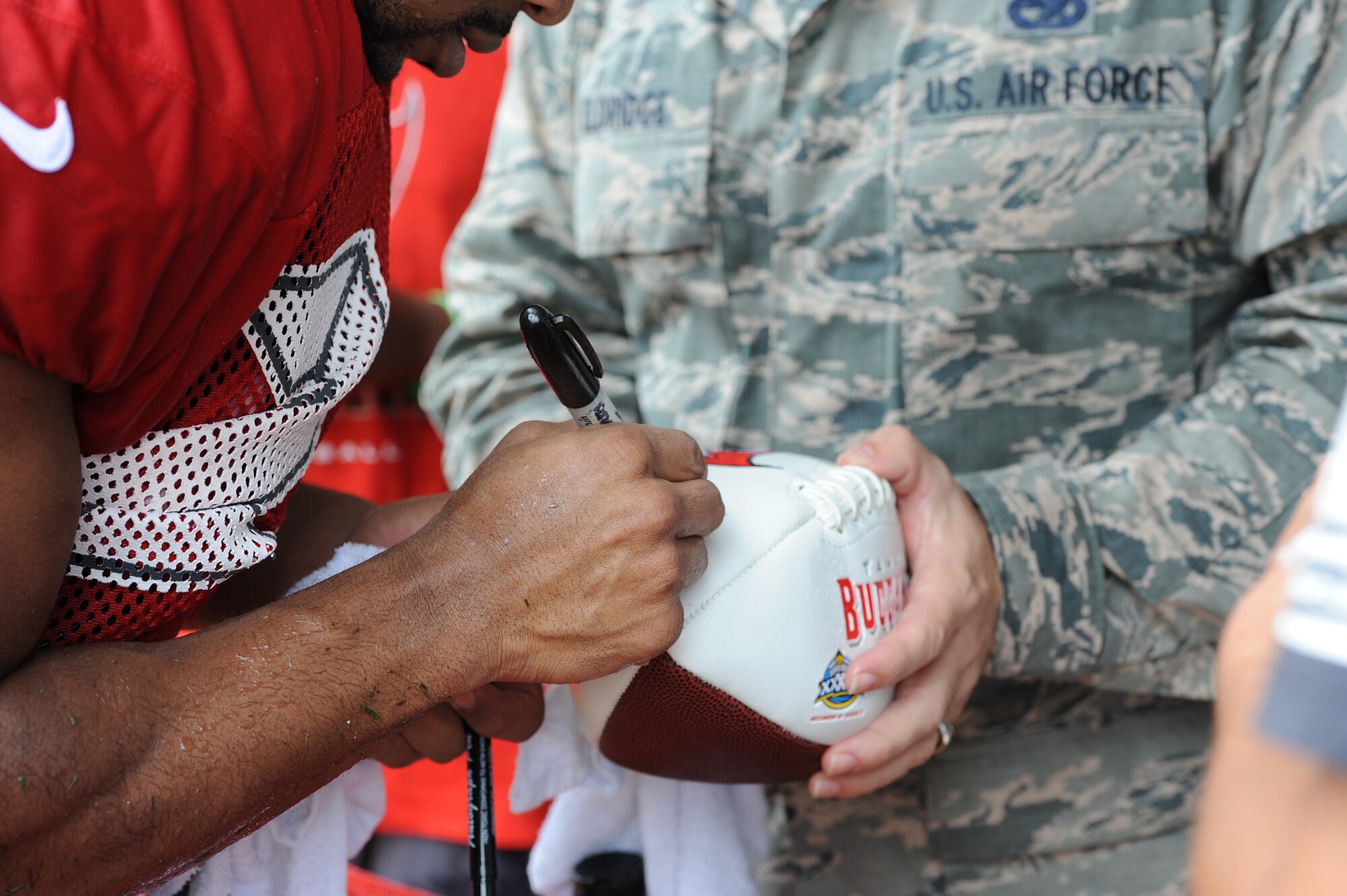 The season’s first pads-on day at the Tampa Bay Buccaneers Training Camp, was no ordinary day at One Buc Place, Tampa, Florida, July 31, 2017. Instead of the bleachers filled with your traditional fans, Airmen from the 927th Air Refueling Wing along with other military members from MacDill Air Force Base, Florida showed up in force to cheer on their hometown team, the Tampa Bay Buccaneers. (U.S. Air Force Photo by TSgt. Peter Dean) 