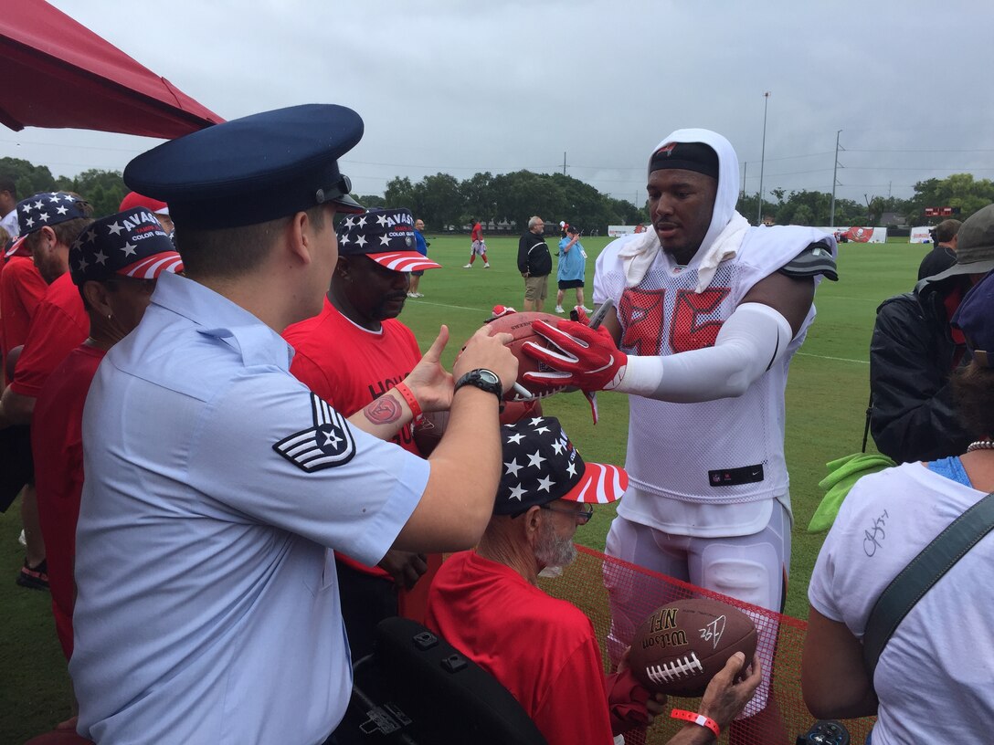 The season’s first pads-on day at the Tampa Bay Buccaneers Training Camp, was no ordinary day at One Buc Place, Tampa, Florida, July 31, 2017. Instead of the bleachers filled with your traditional fans, Airmen from the 927th Air Refueling Wing along with other military members from MacDill Air Force Base, Florida showed up in force to cheer on their hometown team, the Tampa Bay Buccaneers. (U.S. Air Force Photo by TSgt. Peter Dean) 