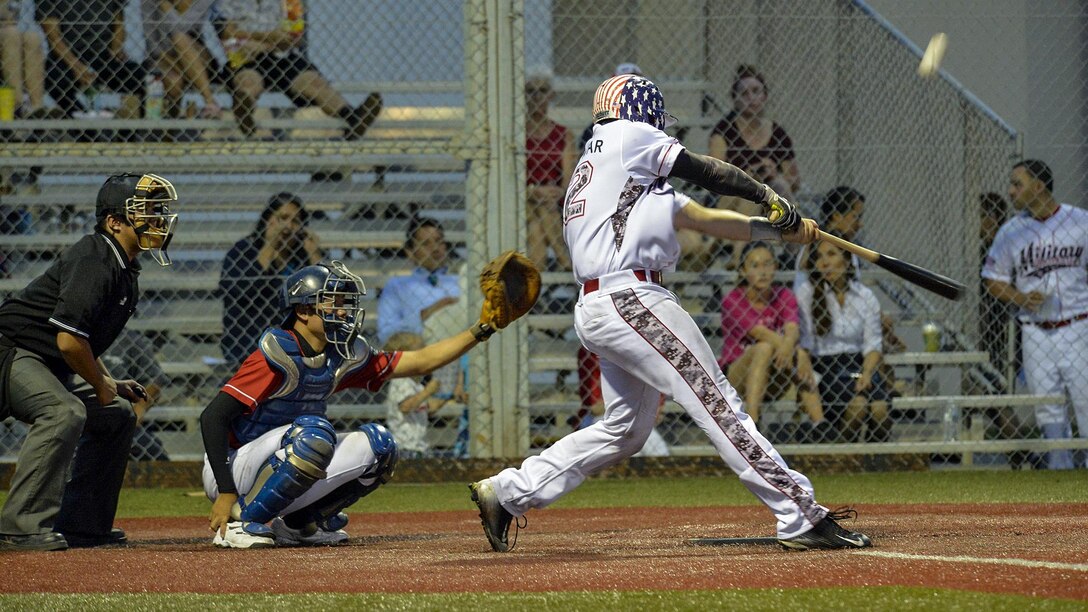 Navy Petty Officer 3rd Class Michael S. Parmer hits a pitch during a baseball game between USA Military Baseball Team Pacific and the Baseball First League All-Stars in Yokosuka, Japan, July 28, 2017. Parmer is a machinist's mate assigned to the USS Blue Ridge, the U.S. 7th Fleet flagship, which is in maintenance to modernize it. Navy photo by Petty Officer 3rd Class Patrick Semales