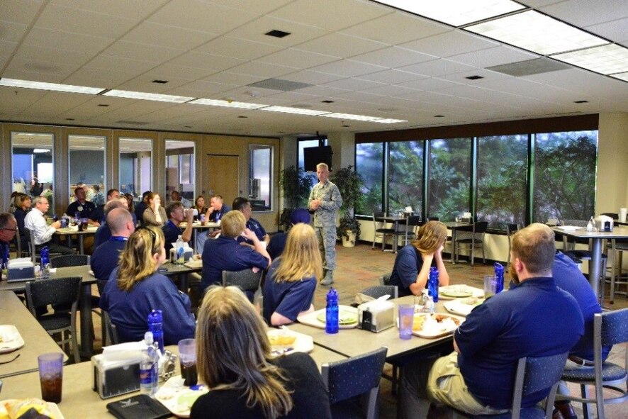 Col. Stephen Slade, 310th Operations Group commander, speaks to FIRST Educators Tour guests in the Satellite DISH dining facility at Schriever Air Force Base, Colorado, Tuesday, July 25, 2017. Slade explained why he joined the U. S. Air Force and why he thinks STEM is so important to its mission.  (U.S. Air Force photo/Halle Thornton)