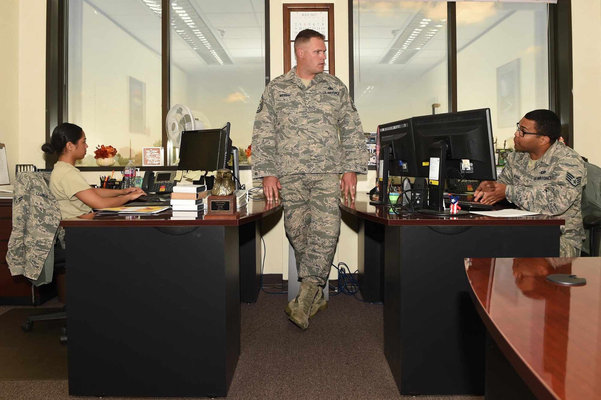 U.S. Air Force Senior Master Sgt. Zachary Merkl, 97th Force Support Squadron, 97th Communications Squadron, 97th Contracting Squadron and 97th Wing Staff Agency first sergeant, checks in with Airmen in his unit, July 24, 2017 at Altus Air Force Base, Oklahoma. First sergeants are the eyes and ears of the squadron for the commander to ensure Airmen are mission ready. (U.S. Air Force Photo by Airman 1st Class Cody Dowell/released)