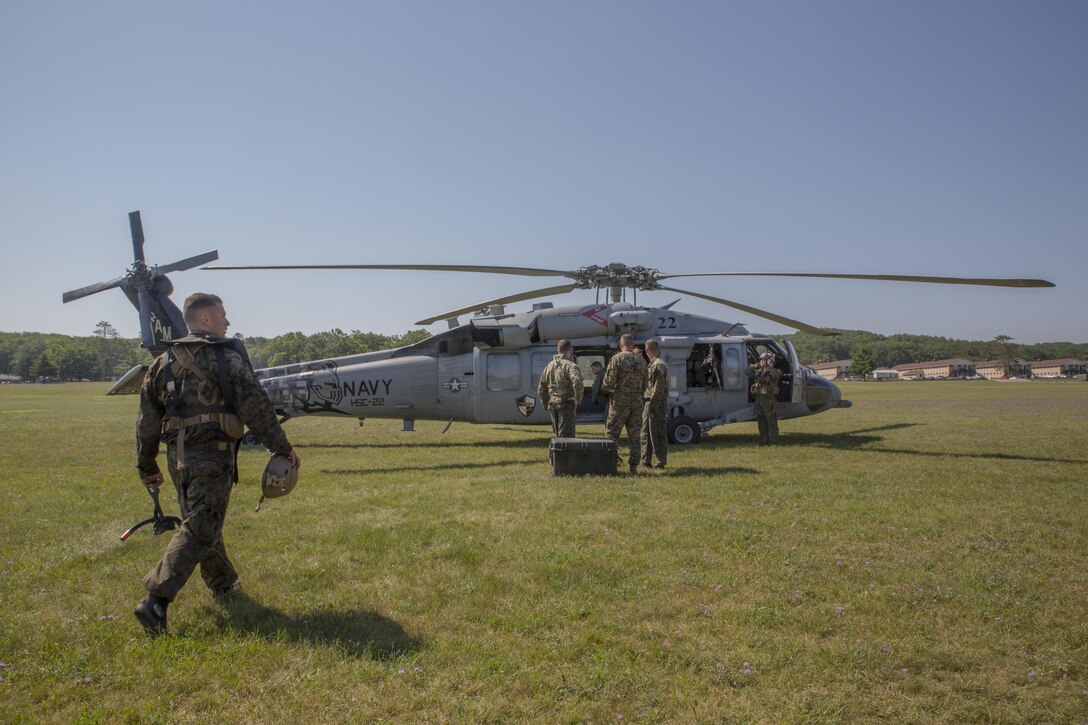 CAMP GRAYLING, Mich. – U.S. Marines from Echo Company, 4th Reconnaissance Battalion, 4th Marine Division, Marine Forces Reserve, prepare for a helocast exercise off of a U.S. Navy Sikorsky SH-60 Seahawk from Sea Combat Squadron 22, at Camp Grayling Joint Maneuver Training Center, Michigan, during exercise Northern Strike 17, July 31, 2017. Helocasting is an airborne technique used by small units and special operations for insertion into military areas of operations. Exercise Northern Strike is a National Guard Bureau-sponsored training exercise that unites service members from multiple branches, states and coalition countries to conduct combined ground and air combat operations.  (U.S. Marine Corps photo by Lance Cpl. Niles Lee/Released)