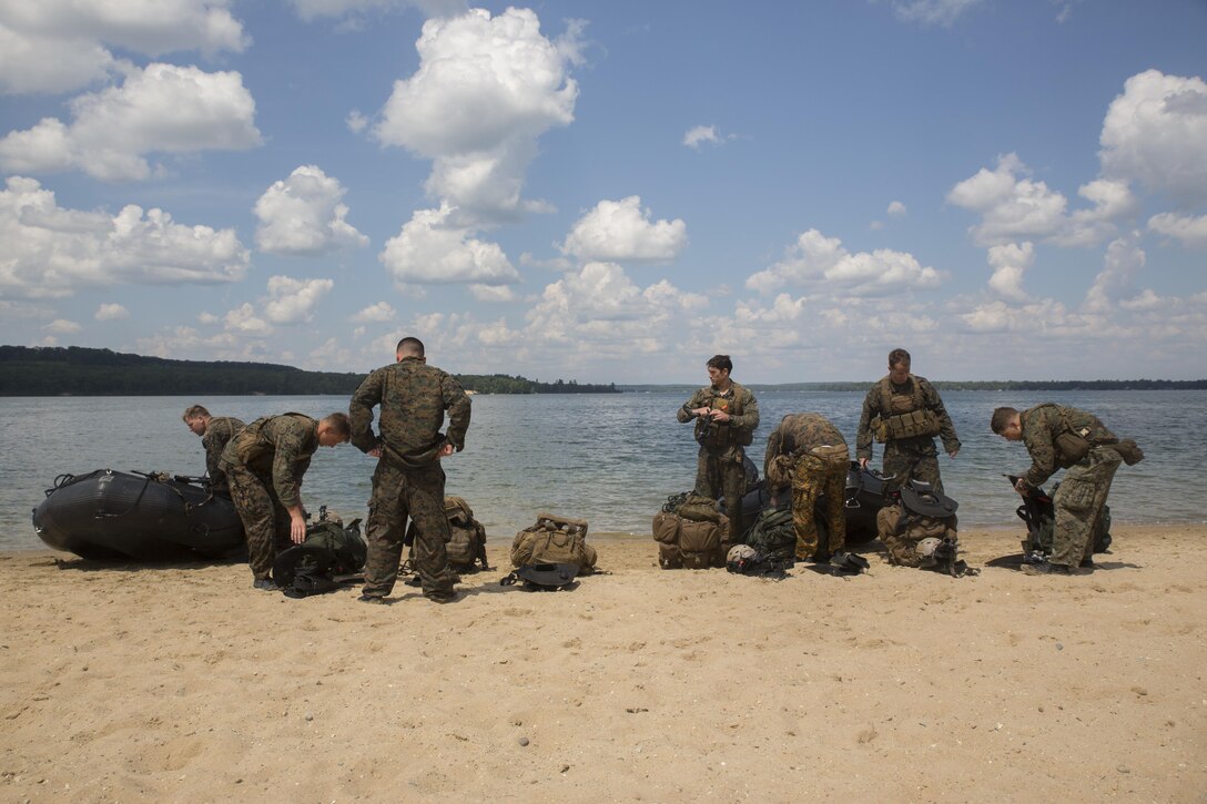 CAMP GRAYLING, Mich. – U.S. Marines from Echo Company, 4th Reconnaissance Battalion, 4th Marine Division, Marines Forces Reserve, check their gear after conducting a helocast exercise into Lake Margrethe at Camp Grayling Joint Maneuver Training Center, Michigan, during exercise Northern Strike 2017, July 31, 2017. Northern Strike 17 prepares Marines from across 4th Marine Division as they prepare for Integrated Training Exercise 2018 and future mobilizations and deployments. (U.S. Marine Corps photo by Lance Cpl. Niles Lee/Released)