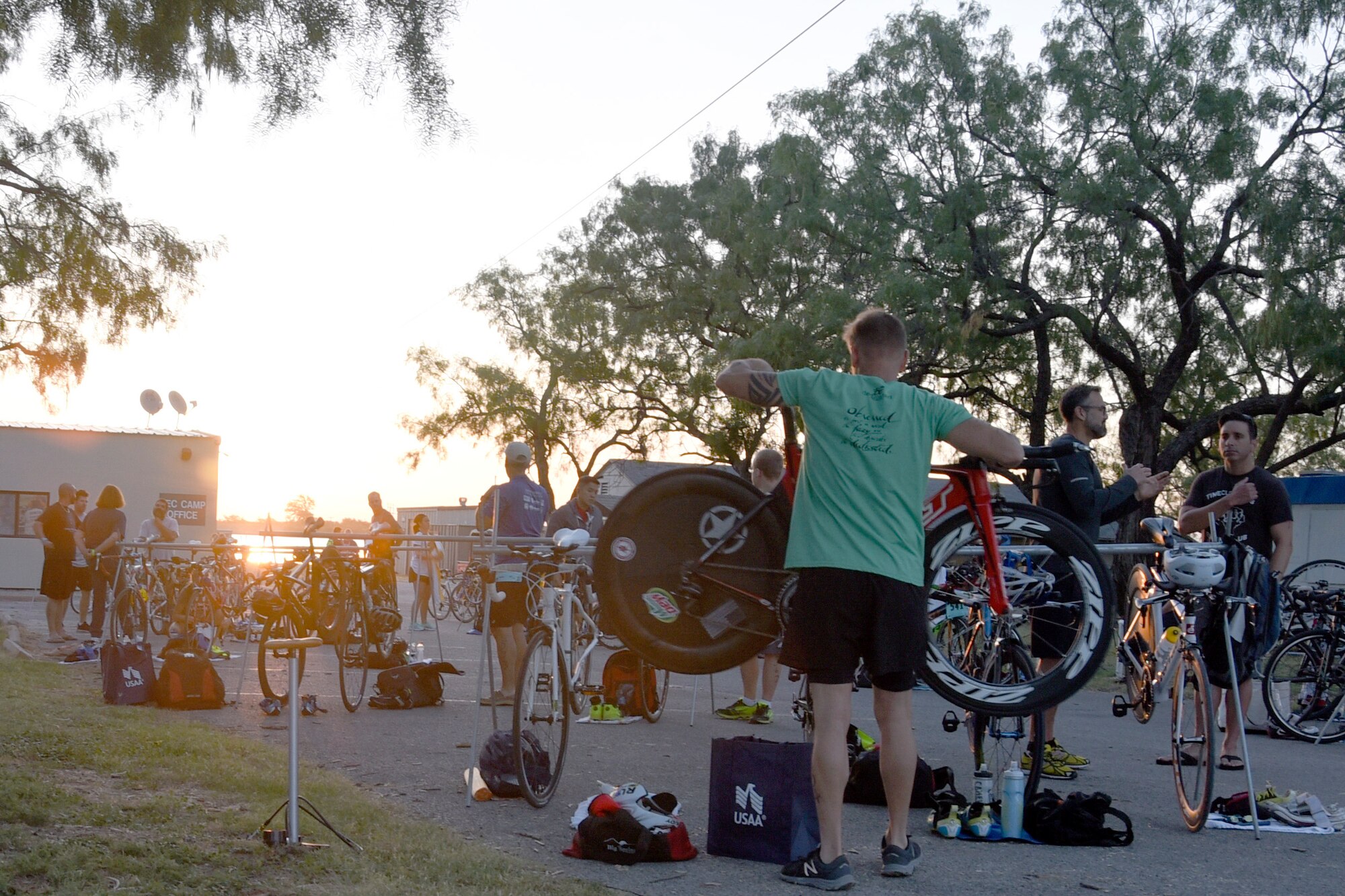 Competitors prepare for the 17th Force Support Squadron’s Annual Sprint Triathlon on July 29, 2017, at the Goodfellow recreational camp, in San Angelo, Texas. The bike area is used as a staging zone for each section of the triathlon. (U.S. Air Force Photo by Amn Zachary Chapman/Released)