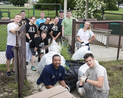 The Airmen Committed to Excellence council pose for a group photo during an ACE council clean-up July 27, 2017, at the Child Development Center on Dover Air Force Base, Del. The council is made up of Airman, airman basic to senior airman, and provides Airmen with opportunities to grow personally and professionally from other Airmen as well as from mentors in other councils. (U.S. Air Force photo by Staff Sgt. Jared Duhon)