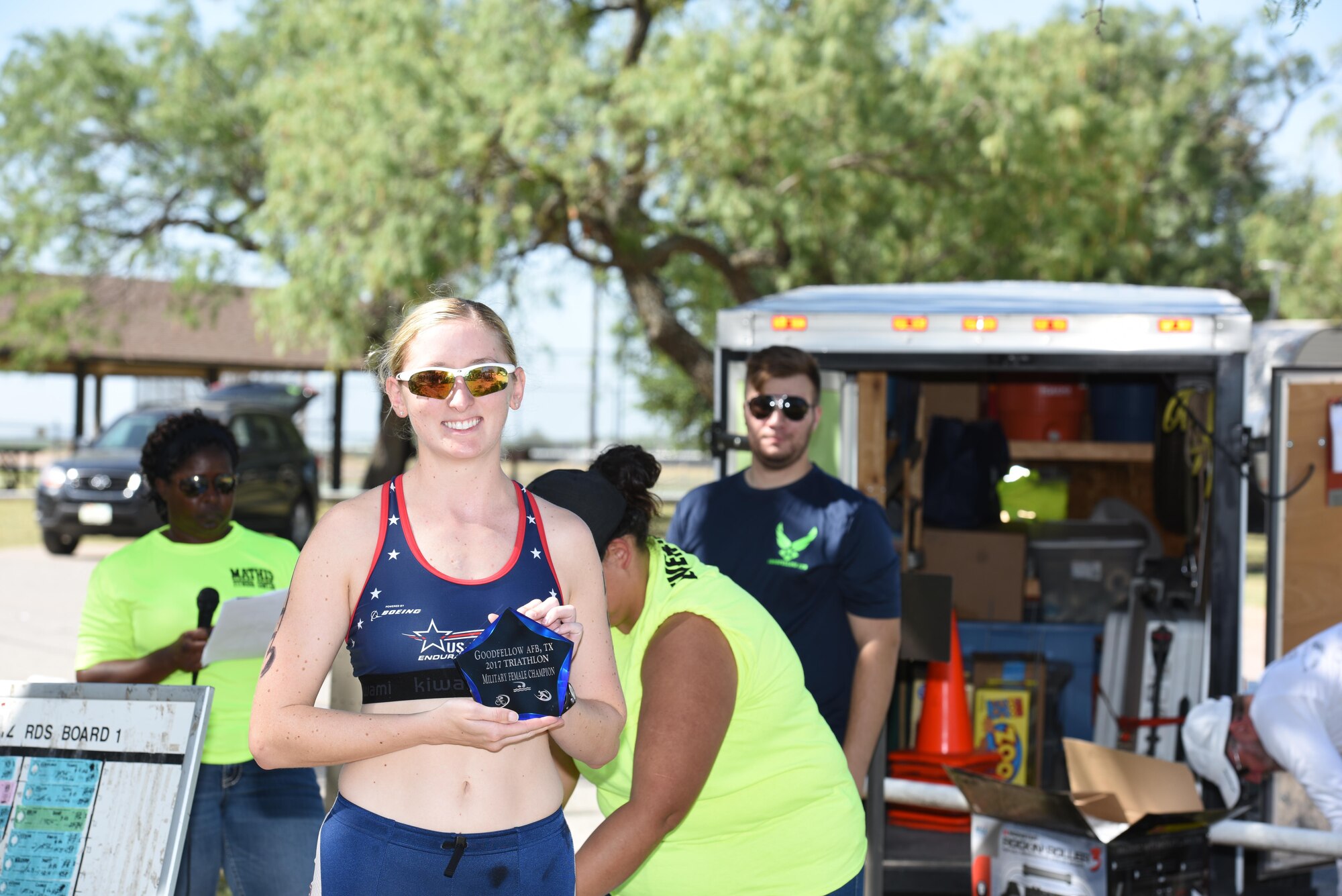 U.S. Air Force Capt. Aubrie Frazier, 17th Medical Support Squadron pharmacy technician, holds an award after the 17th Force Support Squadron’s Annual Sprint Triathlon on July 29, 2017, at the Goodfellow recreational camp, in San Angelo, Texas. Frazier received the top military champion award for her completion time of 1:28:25. (U.S. Air Force Photo by Amn Zachary Chapman/Released)
