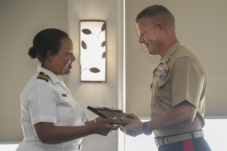 Lt. Gen. Lewis Craparotta, Commanding General, I Marine Expeditionary Force, receives a token of appreciation for his hard work from U.S. Navy Cmdr. Denise McCallaCreary, President of the National Naval Officers Association Symposium (NNOA), at the Admiral Kidd Catering & Conference Center, Naval Base Point Loma, Calif., July 26, 2017. The NNOA actively supports U.S. Marine Corps, Navy, Coast Guard and the National Oceanic and Atmospheric Administration in the recruitment, development and retention of a diverse Officer Corps that is representative of the best our nation has to offer. The theme of this year’s symposium was “Developing Leaders Through Education, Experience and Personal Development.” (U.S. Marine Corps photo by Pfc. Noah M. Rudash)