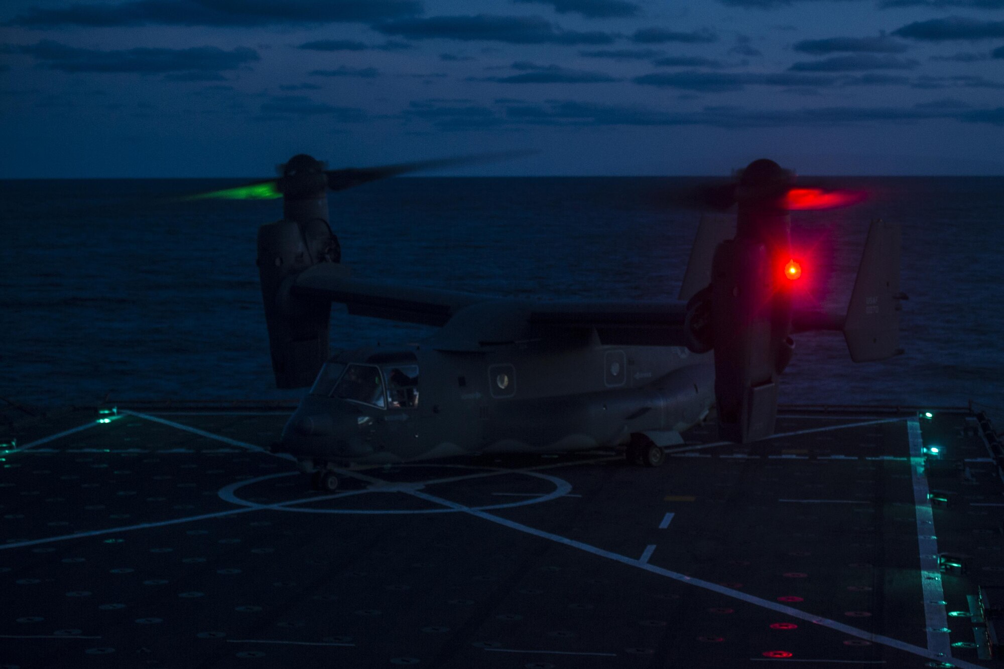 A CV-22 Osprey tiltrotor aircraft with the 8th Special Operations Squadron rests on the amphibious dock landing ship USS Oak Hill (LSD 51) during deck landing qualifications off the coast of Virginia, July 26, 2017. The 8th SOS conducts deck landings four to six times a year to ensure aircrews are qualified, current and ready to conduct global operations any time, any place. (U.S. Air Force photo by Airman 1st Class Joseph Pick)