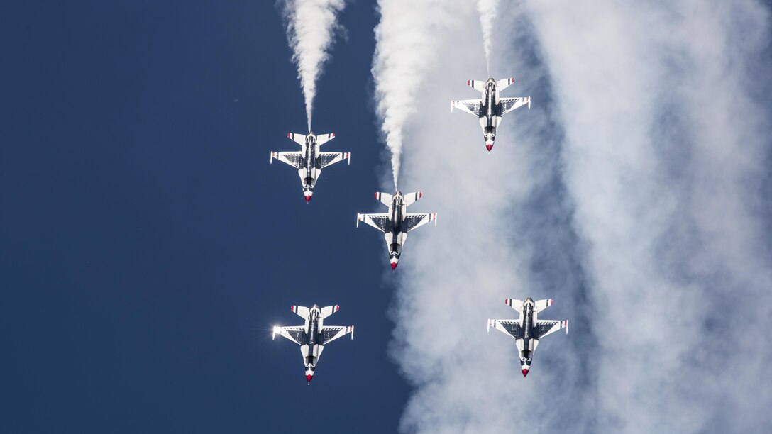 Five F-16 Fighting Falcons from the Thunderbirds, the Air Force's  aerial demonstration team, dive in formation at the Skyfest 2017 air show and open house at Fairchild Air Force Base, Wash., July 20, 2017. Air Force photo by Airman 1st Class Ryan Lackey