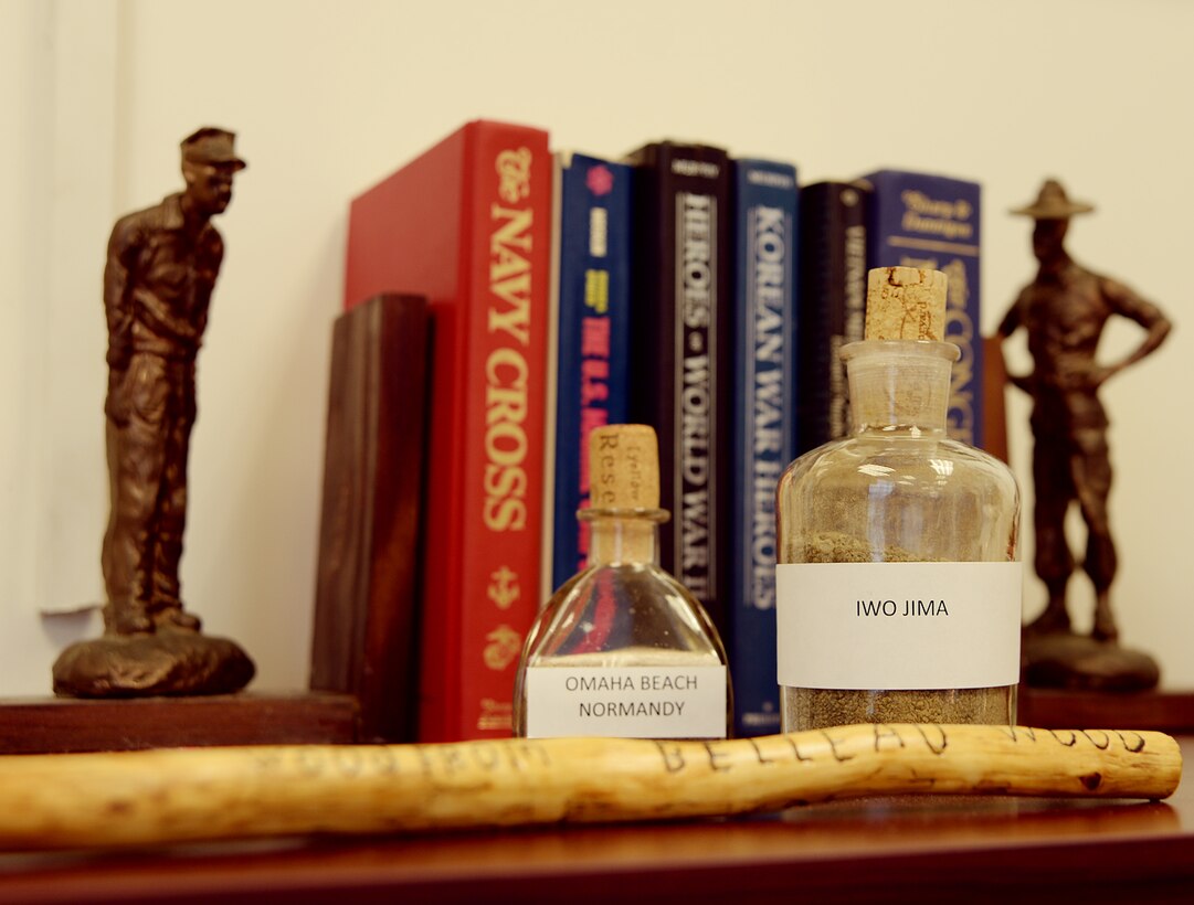 Sand from battles in World War II and other Marine Corps memorabilia line the bookshelves in the office of Kent Morrison, executive director, Marine Corps Logistics Base Albany, as a reminder of those who sacrificed their lives for the Corps and nation. 
