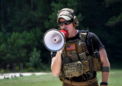 Tech. Sgt. Samuel Weaver, 1st Combat Camera Squadron Weapons and Tactics Training NCO in charge, calls out firing commands during a weapons and tactical movement training event at Fort Jackson, South Carolina, July 20, 2017. The operational mission at Combat Camera is fast paced with a high-ops tempo. Beyond performing visual documentation, combat photojournalists and broadcasters need to be fully trained and qualified with weapons and tactics to operate in joint environments and real-world contingencies.