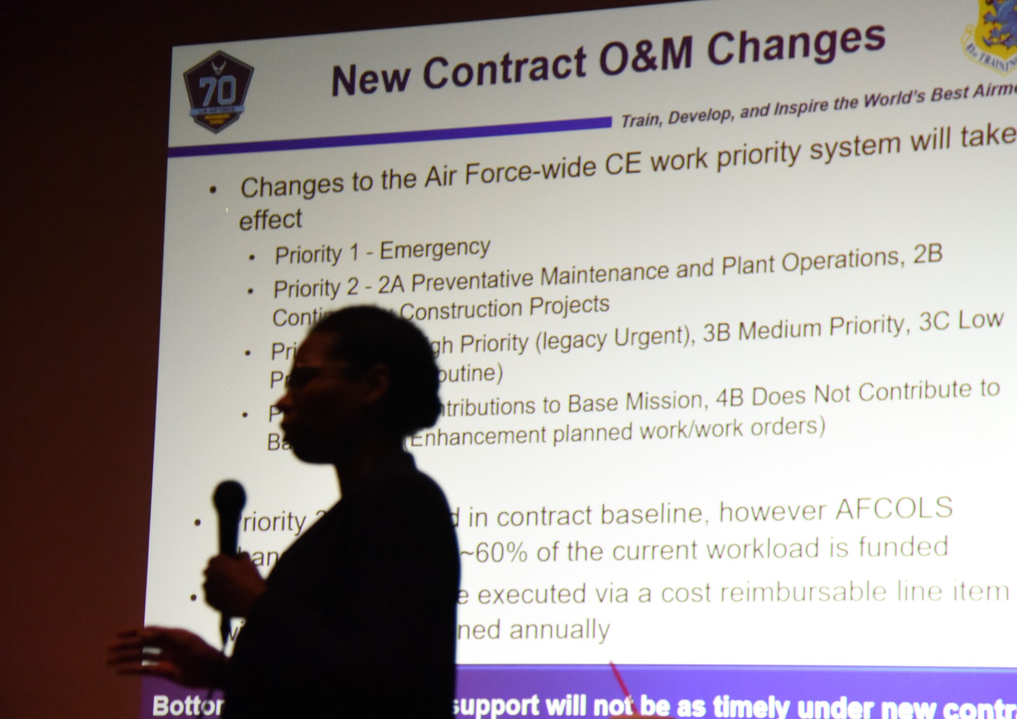 Tasha Golson, 81st Infrastructure Division performance management chief, speaks during the Base Operations Support town hall meeting at the Welch Theater July 26, 2017, on Keesler Air Force Base, Miss. The meeting was to discuss the new base operations support contract revisions. (U.S. Air force photo by Kemberly Groue)