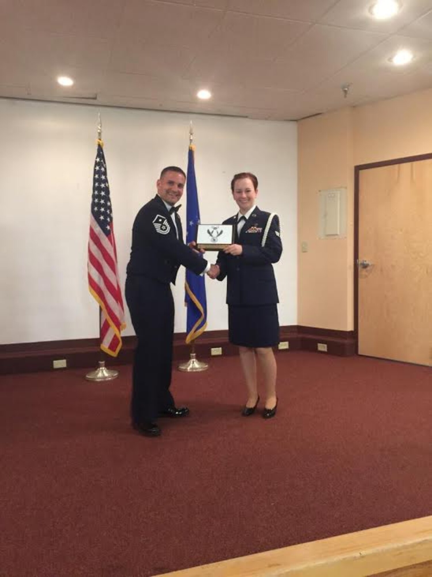 U.S. Air Force Staff Sgt. Jessica Doll, 40th Airlift Squadron resource manager, receives the Airman Leadership School Distinguished Graduate Award at Dyess Air Force Base, Texas. Doll, who previously struggled with depression within the last year and is a sexual assault survivor, became certified in March as a Sexual Assault Prevention and Response Volunteer Victim Advocate to help others going through similar situations. (Courtesy photo)