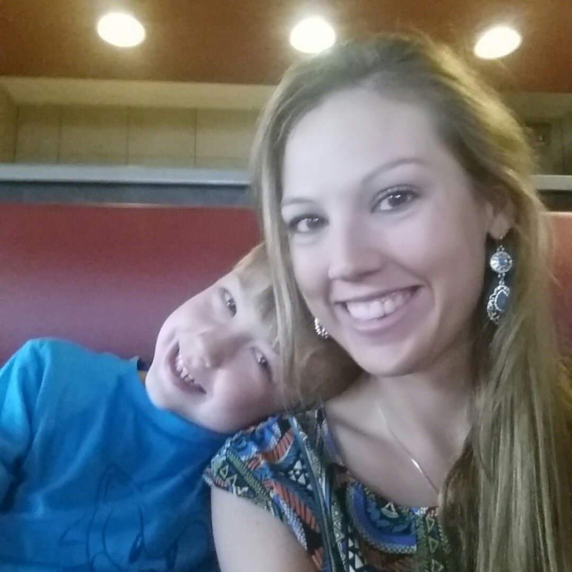 U.S. Air Force Tech. Sgt. Stephanie Stearns, 7th Force Support Squadron Airman Leadership School instructor, poses for a photo with her son she had with her deceased husband. Stearns tells her story about how she escaped an abusive relationship by having inner strength as well as her Air Force family to lean on. (Courtesy photo)