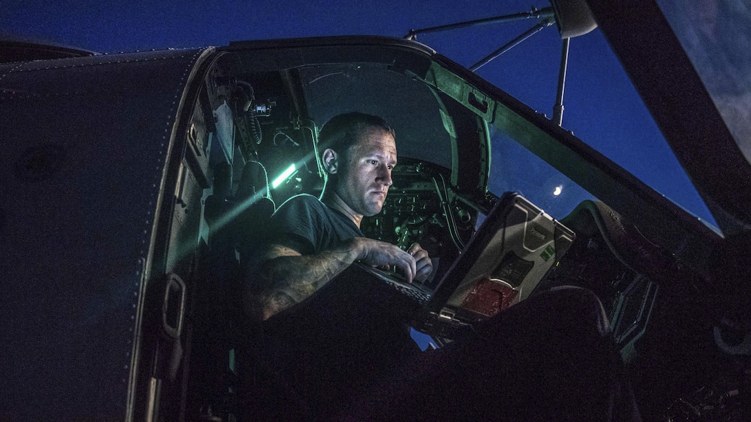 Navy Petty Officer 2nd Class Matt Bouley performs maintenance on an MH-60R Seahawk helicopter aboard the guided-missile cruiser USS Princeton in the Arabian Gulf, July 27, 2017.Bouley is an aviation electrician's mate. Navy photo by Petty Officer 3rd Class Kelsey J. Hockenberger