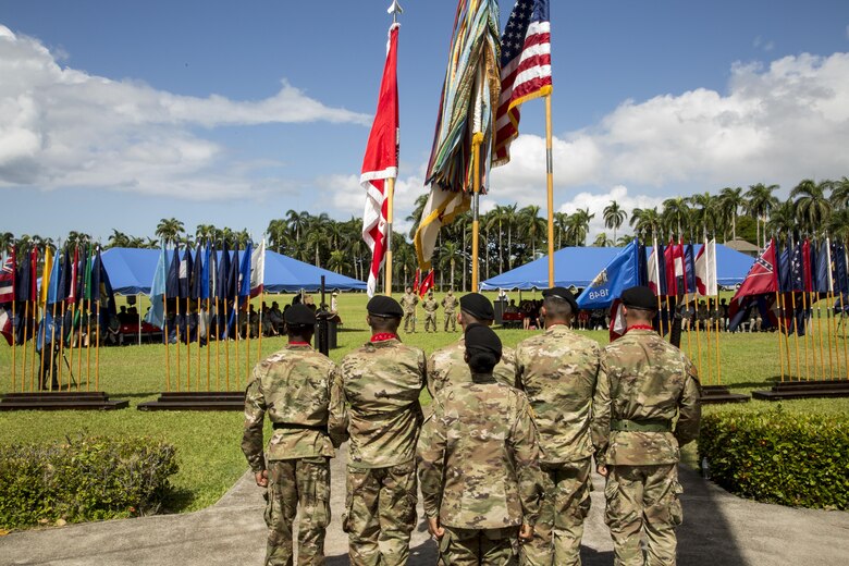 The 130th Engineer Brigade Color Guard team (foreground), under the direction of Pacific Ocean Division’s Command Sgt. Maj. Yolanda Tate, is set to post the Colors at a ceremony, July 27, at historic Palm Circle, Fort Shafter, Hawaii.  The official party, in the background, stands at parade rest, while they await the cue to begin the change of command ceremony, when Col. Thomas J. Tickner becomes the 33rd commander of the Pacific Ocean Division, U.S. Army Corps of Engineers. Photo by Duy Ta, USACE-ACE-IT