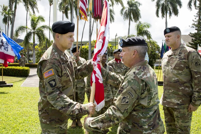 Col. Thomas J. Tickner (left) receives the Army Colors from Lt. Gen. Todd T. Semonite, Chief of Engineers and Commanding General of the U.S. Army Corps of Engineers in a Change-of-Command ceremony, July 27, at Fort Shafter, Hawaii.   Brig. Gen. Peter B. Andrysiak (right) relinquished command of the USACE-POD to Tickner, who became the 33rd commander of the division. Photo by Duy Ta, USACE-ACE-IT