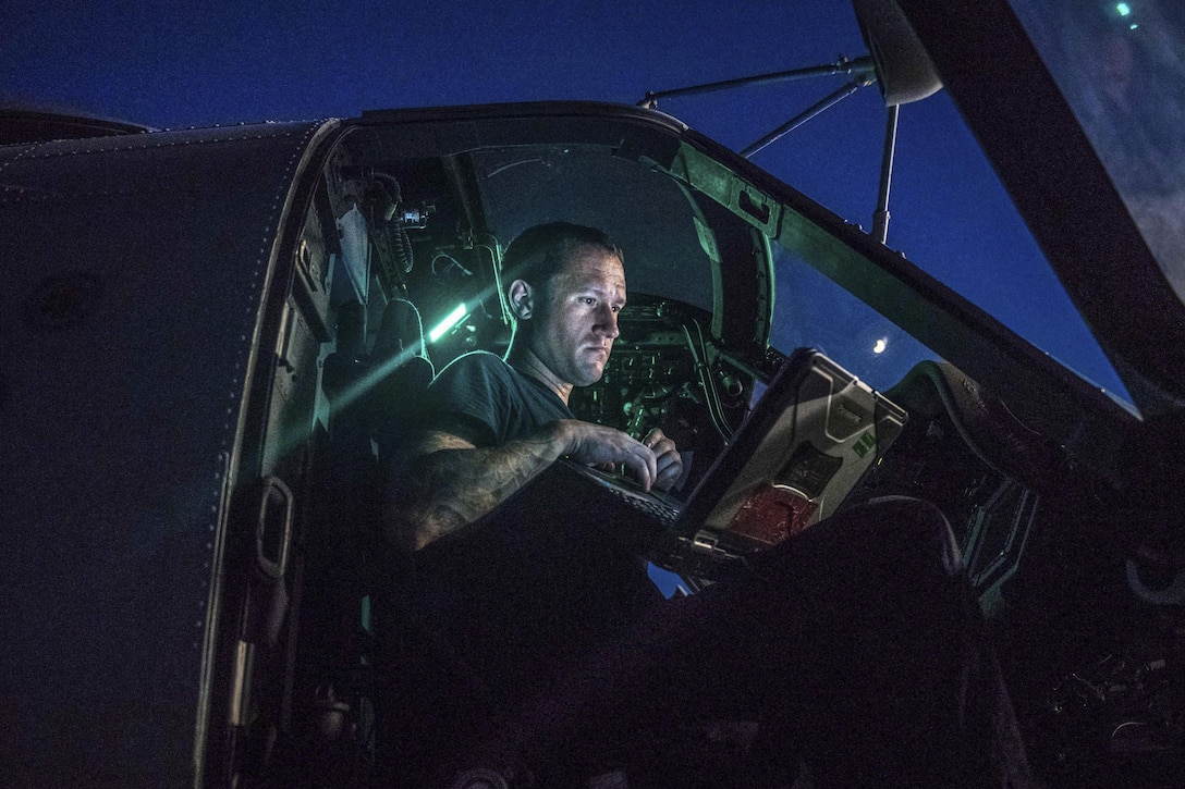 Navy Petty Officer 2nd Class Matt Bouley performs maintenance on an MH-60R Seahawk helicopter aboard the guided-missile cruiser USS Princeton in the Arabian Gulf, July 27, 2017.Bouley is an aviation electrician's mate. Navy photo by Petty Officer 3rd Class Kelsey J. Hockenberger