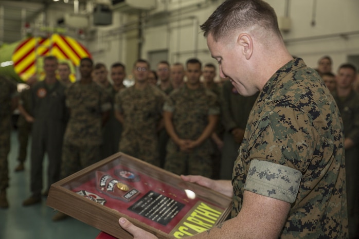 U.S. Marine Corps Chief Warrant Officer 4 Derek McCarthy, the officer in charge of Aircraft Rescue and Firefighting (ARFF) with Headquarters and Headquarters Squadron (H&HS), accepts a memorial box at Marine Corps Air Station Iwakuni, Japan, Aug. 1, 2017. Marines presented McCarthy with the box after celebrating their accomplishments as the 2016 ARFF Unit of the Year and the 2016 United States Marine Corps Small Fire Department of the Year. (U.S. Marine Corps photo by Lance Cpl. Gabriela Garcia-Herrera)