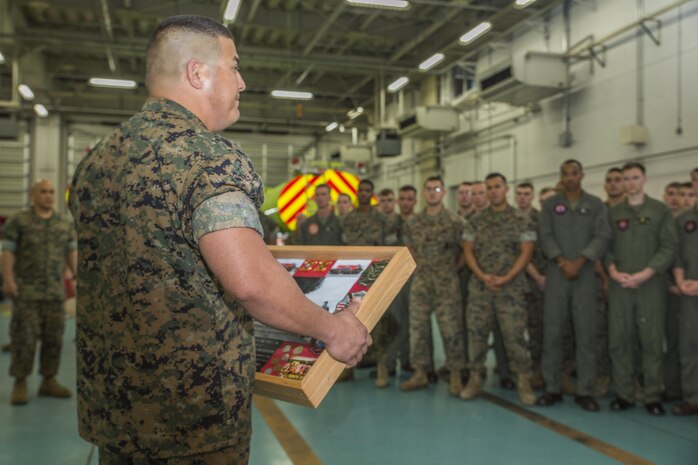 U.S. Marine Corps Master Sgt. Marcos Martinez, staff noncommissioned officer in charge of Aircraft Rescue and Firefighting (ARFF) with Headquarters and Headquarters Squadron (H&HS), accepts a memorial box at Marine Corps Air Station Iwakuni, Japan, Aug. 1, 2017. ARFF celebrated their accomplishment as the 2016 ARFF Unit of the Year and the 2016 United States Marine Corps Small Fire Department of the Year. Marines thanked Martinez with mementos from Iwakuni to remind him of his time served at the station as he prepares to depart from the installation. (U.S. Marine Corps photo by Lance Cpl. Gabriela Garcia-Herrera)