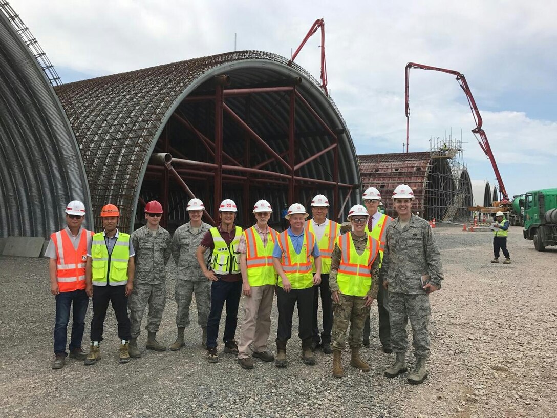 Far East District (FED) commander Col. Teresa Schlosser (third from right), along with members of FED leadership, visit Kunsan resident office to inspect the concrete placement of a hardened aircraft flow through shelter Aug. 2.
