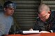 U.S. Air Force Tech. Sgt. Joshua Martin, 20th Maintenance Group maintenance quality assurance (QA) technician, right, reviews the work of Airman 1st Class Holden Godwin, 20th Aircraft Maintenance Squadron tactical aircraft maintainer, at Shaw Air Force Base, S.C., Aug. 1, 2017. Along with inspecting their work, QA provides mentoring opportunities for numerous maintenance Airmen. (U.S. Air Force photo by Senior Airman Christopher Maldonado)