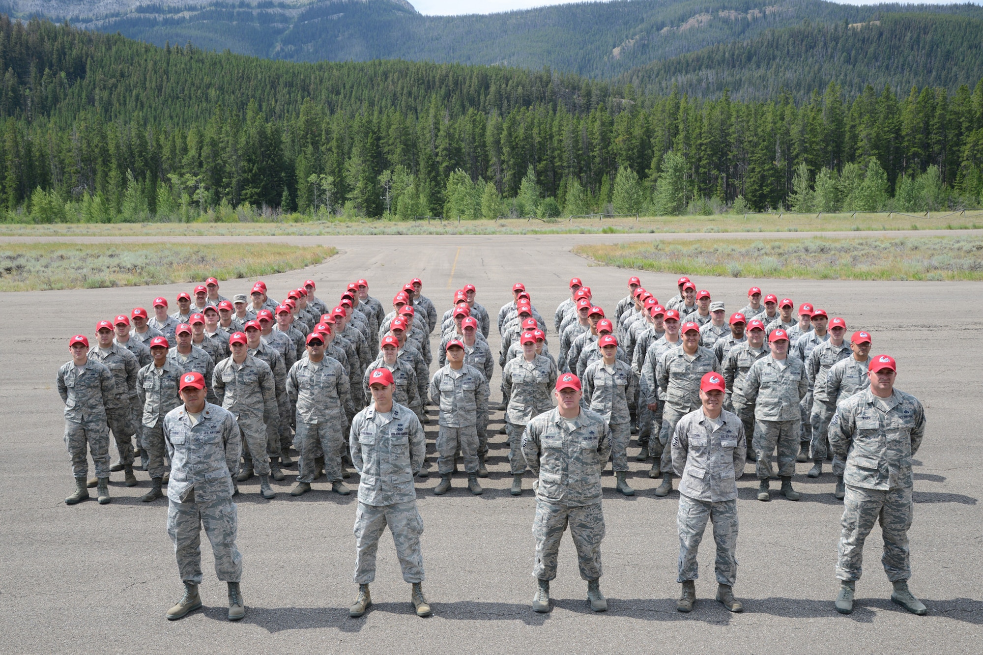 Airmen from the 819th RED HORSE Squadron pose for a group photo during an exercise July 27, 2017, at the Benchmark Airport near Augusta, Mont.