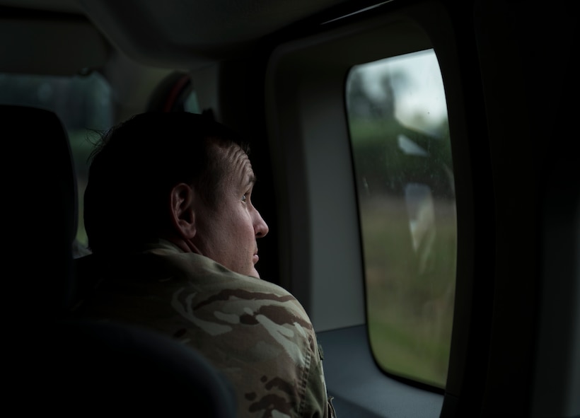 Squadron Leader Neil Beeston, officer commanding Air Land Integration Cell, looks out of a window as 23d Wing A-10C Thunderbolt IIs fly overhead during a close air support training exercise, July 26, 2017, in Lakeland, Ga. Two RAF members recently spent time with the 93d Air Ground Operations Wing to compare and to contrast how each entity conducts business and plan future coalition training events. (U.S. Air Force photo by Airman 1st Class Daniel Snider)