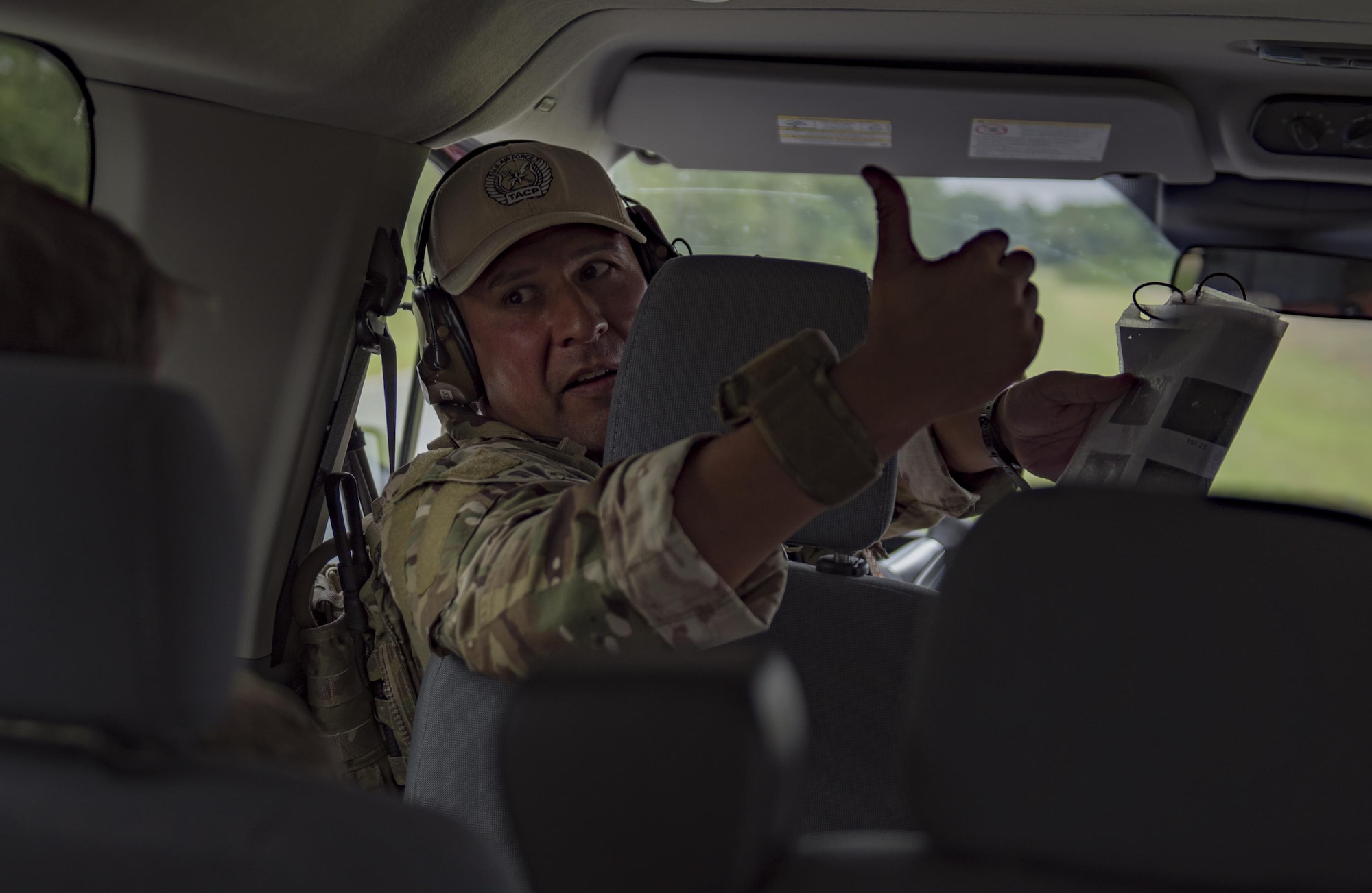 Master Sgt. Francisco Corona, 93d Air Ground Operations Wing NCO in charge of weapons and tactics, communicates with a fellow joint Terminal Attack Controller during a close air support training exercise, July 26, 2017, in Lakeland, Ga. Two RAF members recently spent time immersing with the 93d Air Ground Operations Wing to compare and contrast how each entity conducts business and plan future coalition training events. (U.S. Air Force photo by Airman 1st Class Daniel Snider)