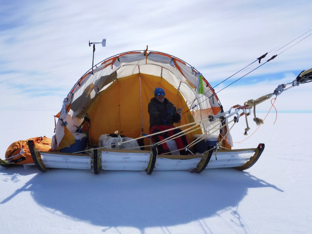 Researchers use a wind-driven sled to cross the Greenland ice sheet