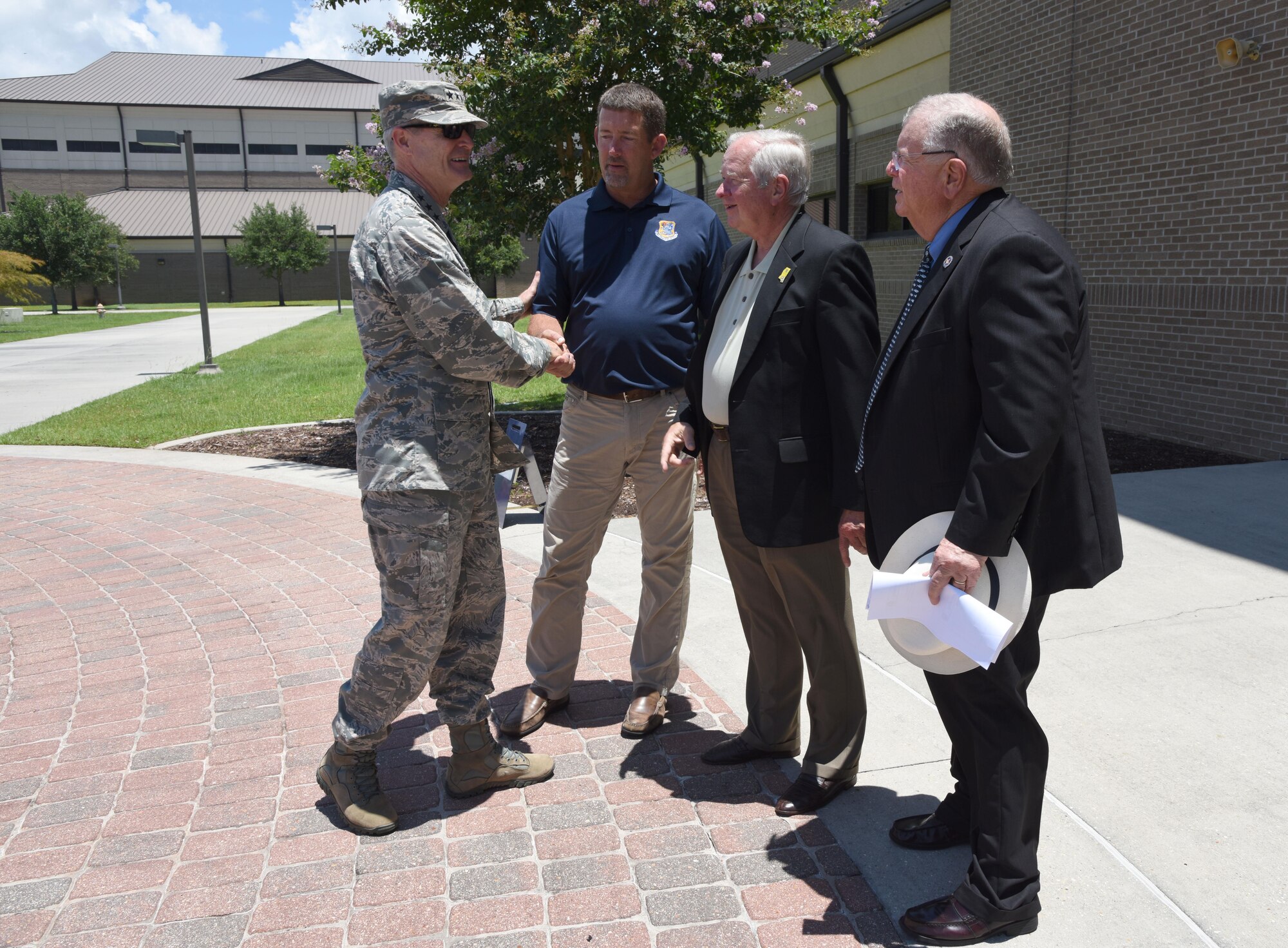 Lt. Gen. Darryl Roberson, commander of Air Education and Training Command, says good-bye to John Boothby, Frank Genzer and Lenny Sawyer, Keesler honorary commanders, after a tour at Matero Hall July 19, 2017, at Keesler Air Force Base, Miss. (U.S. Air Force photo by Kemberly Groue)