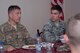 Chief Master Sgt. John Montgomery, U.S. Air Forces Central Command command chief , speaks with Airman 1st Class Cody Martin, 386th Expeditionary Communication Squadron client systems technician during a lunch with airmen Monday July 31, 2017, at an undisclosed location in Southwest Asia. (U.S. Air Force photo by Master Sgt. Eric M. Sharman)