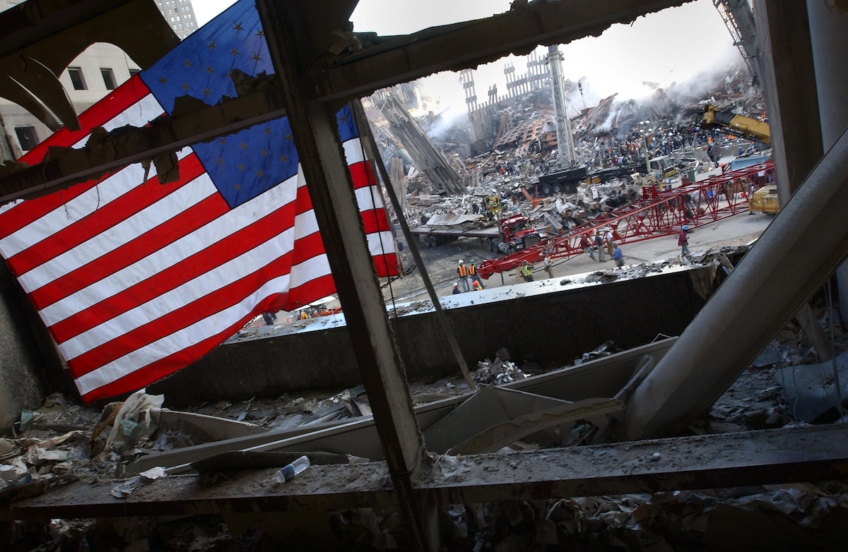 The American flag is displayed among remnants at ground zero.