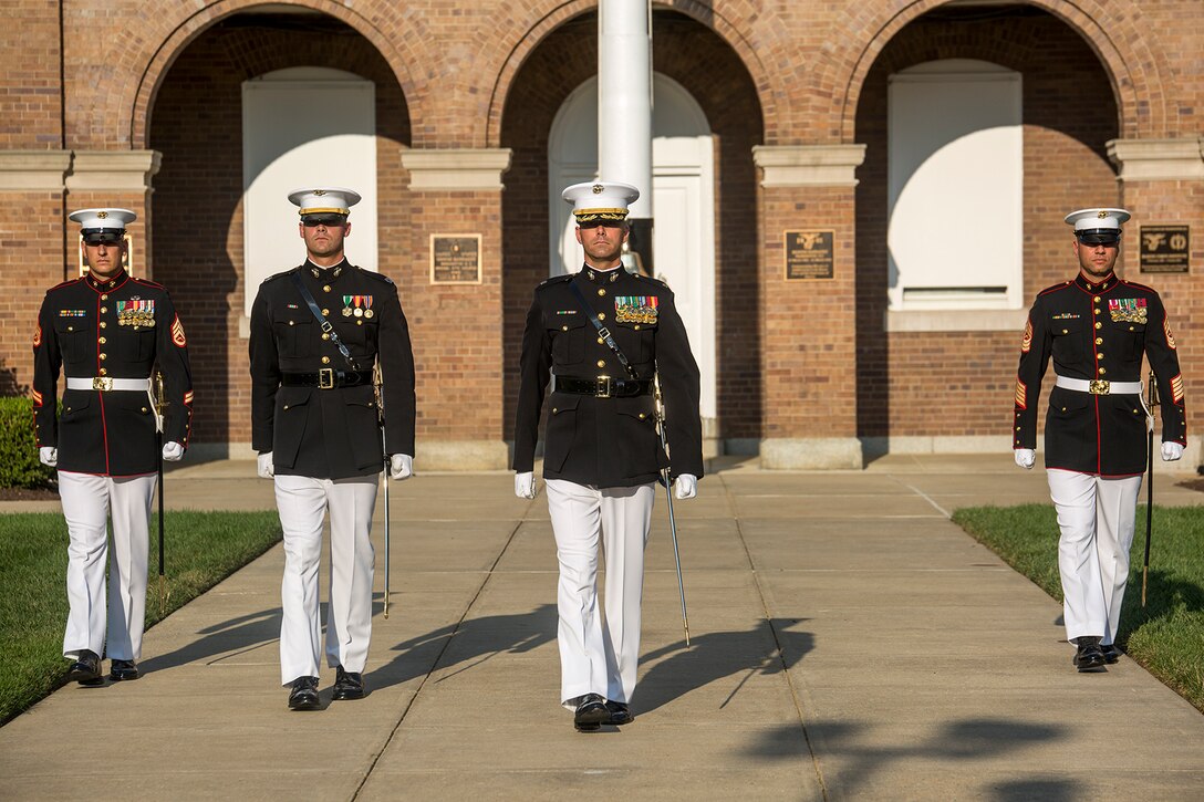 Marines with the parade staff march down center walk during a retirement ceremony for Lt. Gen. Ronald L. Bailey, deputy commandant, Plans, Policies, and Operations, at Marine Barracks Washington D.C., July, 31, 2017. Bailey was most recently assigned to Headquarters Marine Corps and served 40 honorable years in the Corps.(Official Marine Corps photo by Cpl. Robert Knapp/Released)