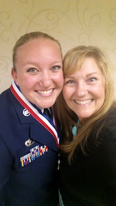 (From left) U.S. Air Force Staff Sgt. Brittany E.N. Murphy, 633rd Air Base Wing photojournalist, and her mom Mary Dudley pose for a photo during an Airman Leadership School graduation at Joint Base Langley-Eustis, Va., May 12, 2016