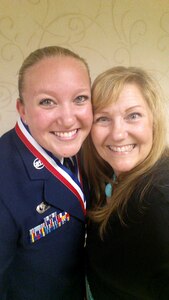 (From left) U.S. Air Force Staff Sgt. Brittany E.N. Murphy, 633rd Air Base Wing photojournalist, and her mom Mary Dudley pose for a photo during an Airman Leadership School graduation at Joint Base Langley-Eustis, Va., May 12, 2016