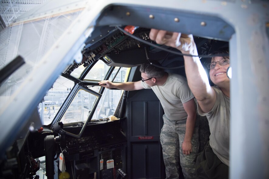 Senior Airman Gage Adkins, 913th Maintenance Squadron crew chief from Little Rock Air Force Base, Arkansas, and Master Sgt. Angela Psket, 403rd Maintenance Squadron crew chief, check the window seals in a C-130J Super Hercules aircraft July 24, 2017 at Keesler AFB, Mississippi. (U.S. Air Force photo/Staff Sgt. Heather Heiney)